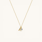 Nadare Co. gold plated stainless steel necklace featuring an uppercase serif letter A charm and a small crystal.