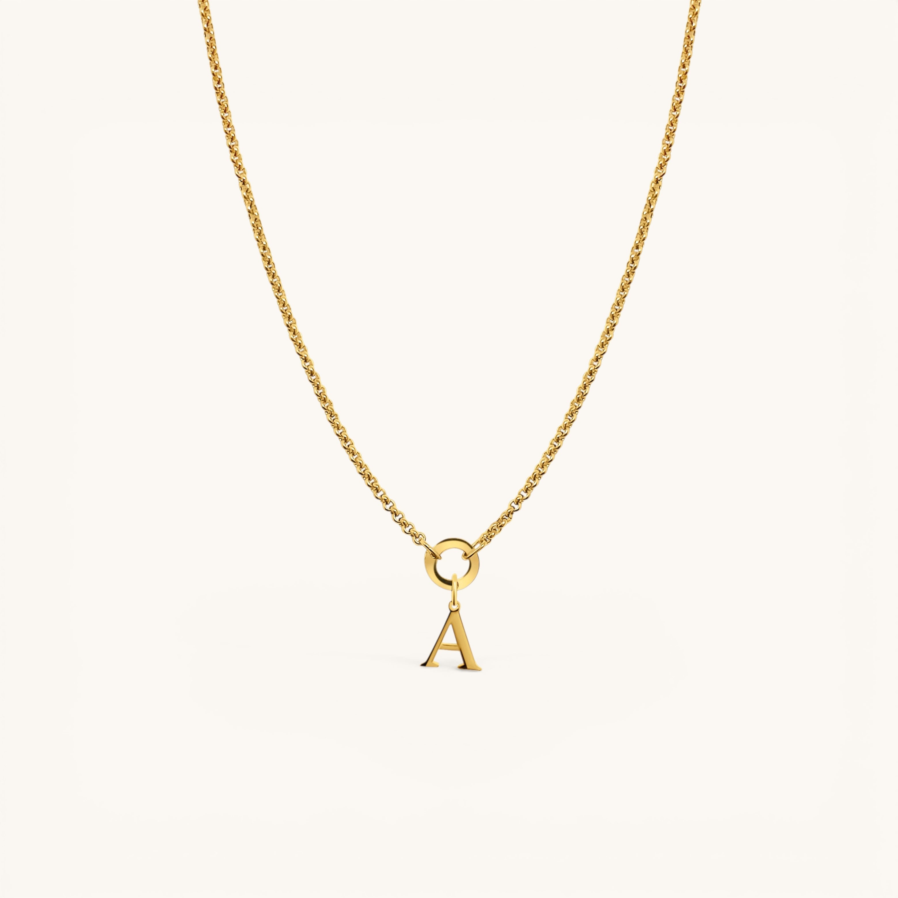 Nadare Co. 14k gold plated stainless steel necklace featuring a polished serif letter A initial charm