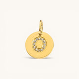 Nadare Co. gold initial "O" charm with pavé diamonds on a polished disc.