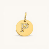 Nadare Co. gold initial P charm with pavé diamond detailing on a polished disc.