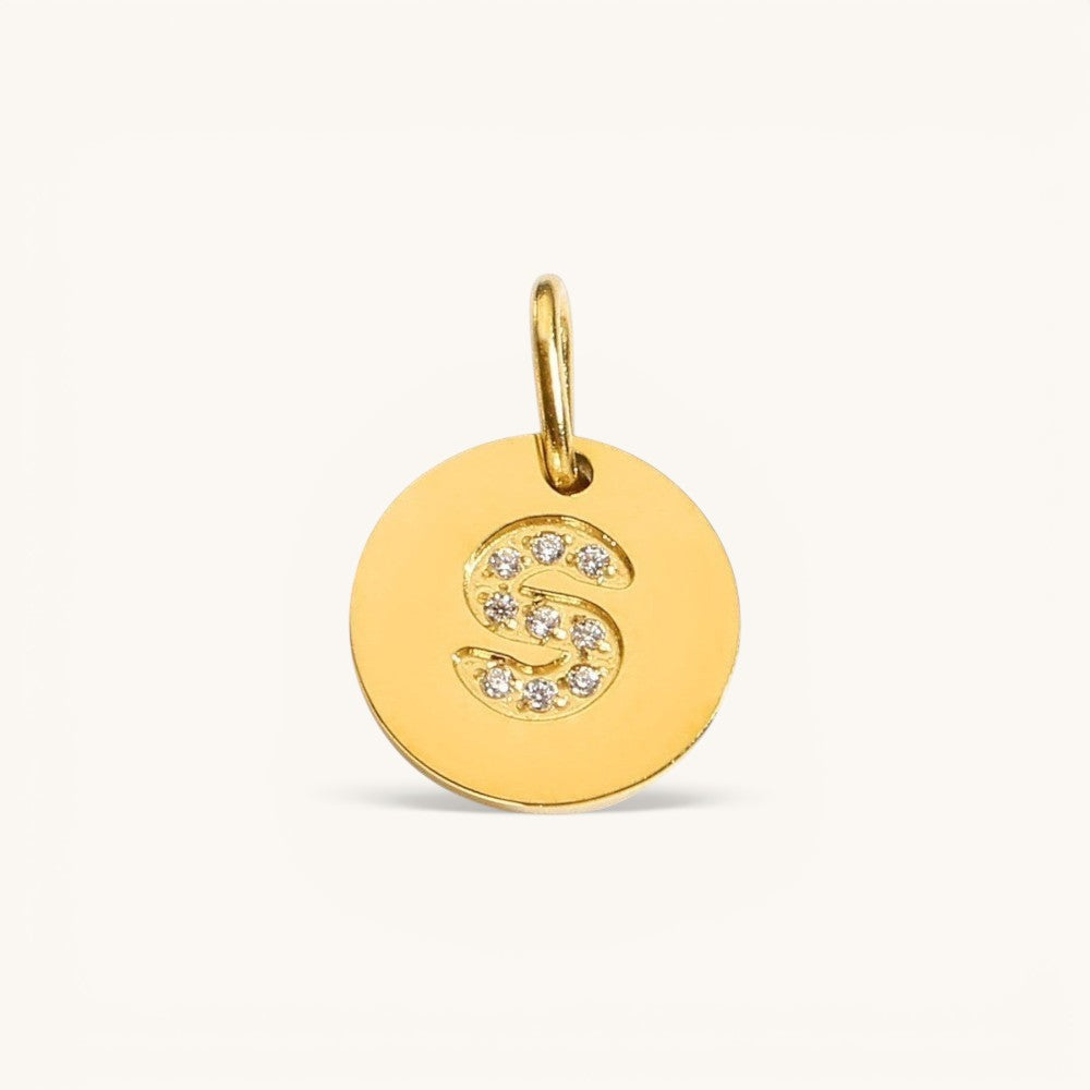Nadare Co. gold initial S charm with pavé set cubic zirconia on a polished disc.