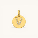 Nadare Co. gold initial V charm with pavé set cubic zirconia on a polished disc.