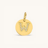 Nadare Co. gold initial W charm with pavé diamond detailing on a polished disc.