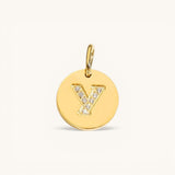 Nadare Co. gold initial Y charm with pavé set diamonds on a polished disc.