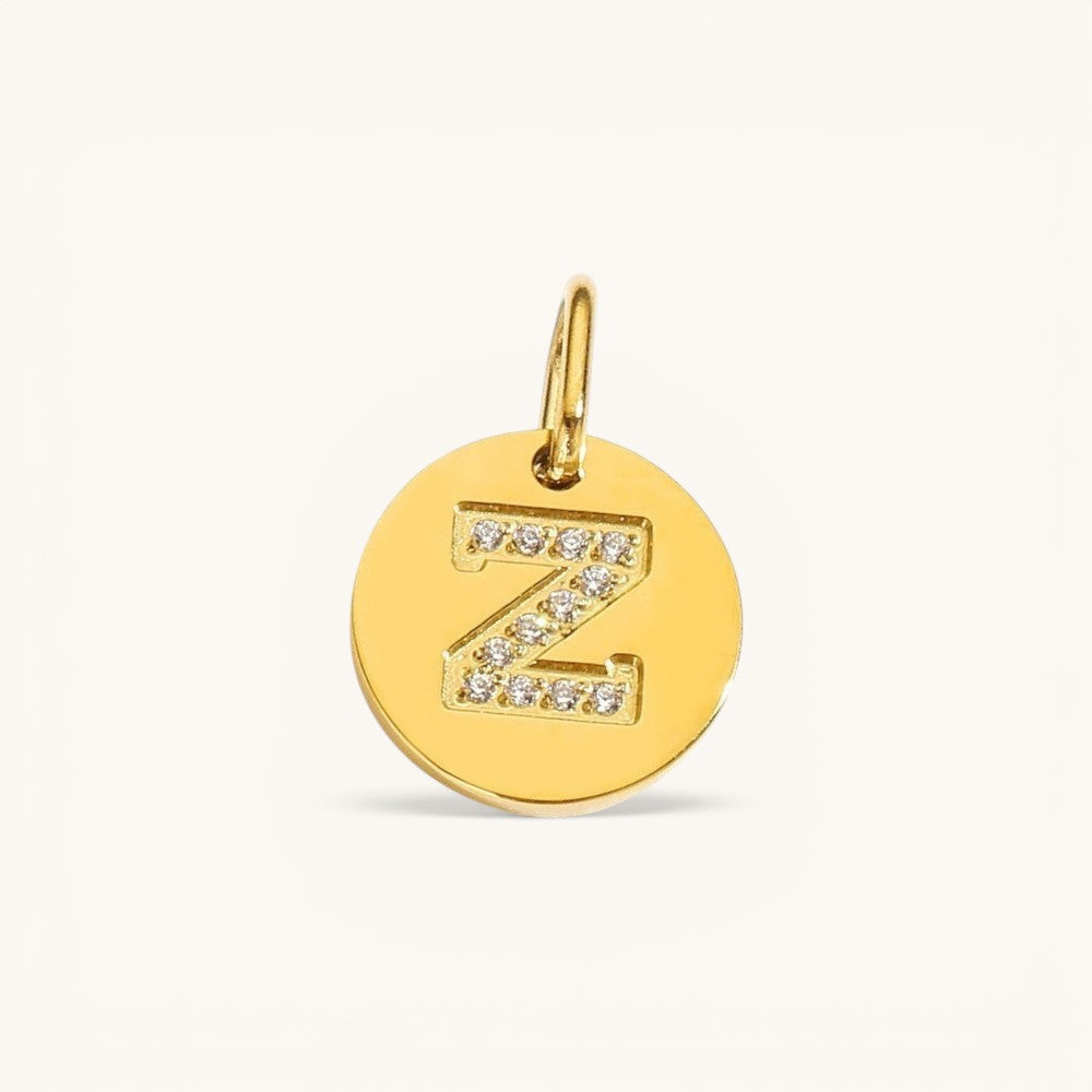 Nadare Co. gold initial Z charm with pavé set cubic zirconia on a polished disc.