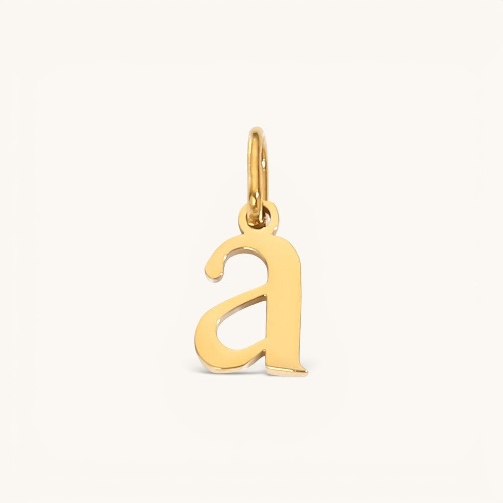 Nadare Co. lower case letter a charm in 14k gold-plated stainless steel with a polished finish.