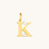 Nadare Co. gold-plated stainless steel letter K charm with a classic serif font for everyday layering.