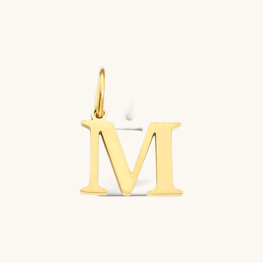 Nadare Co. gold-plated stainless steel letter M charm with a classic serif font design.