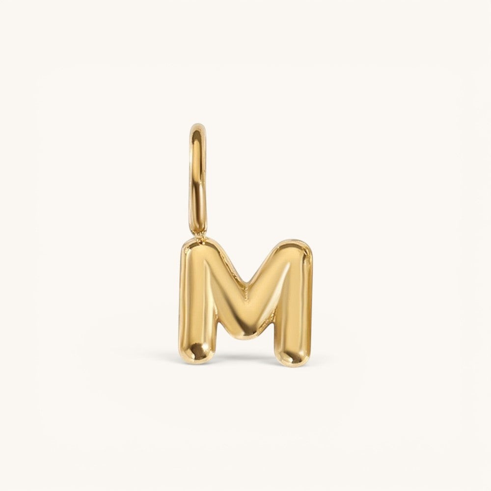 Nadare Co. gold-plated stainless steel bubble letter M charm with a playful, rounded puffed design.