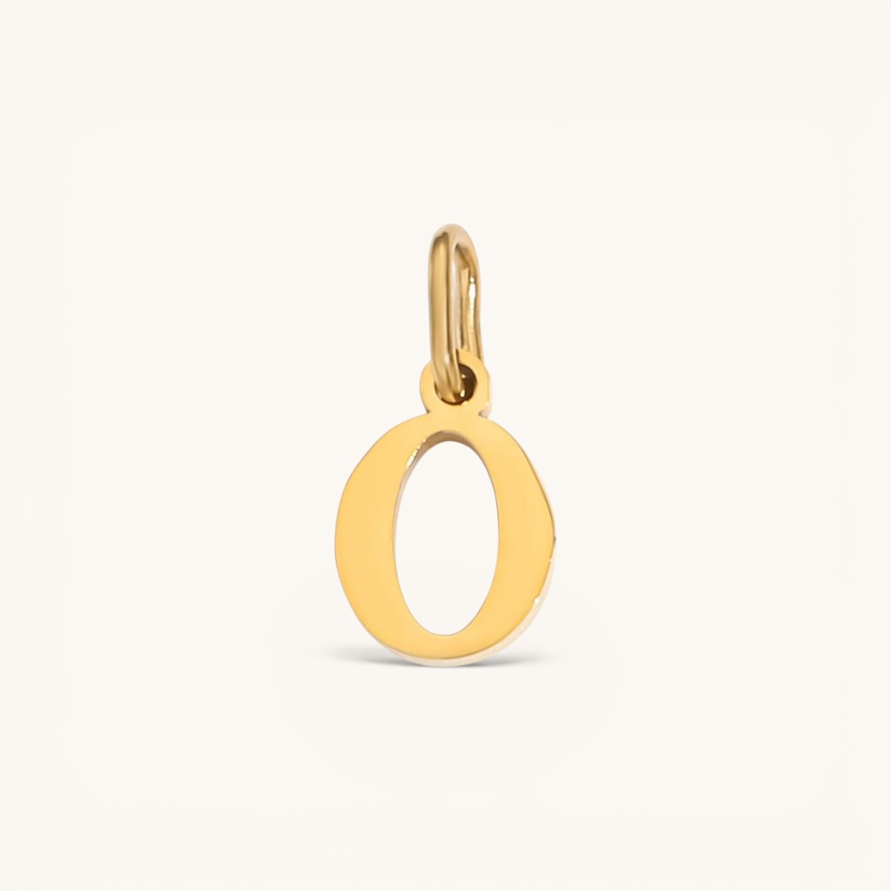 Nadare Co. lower case letter O charm in 14k gold plated stainless steel for everyday layering.