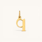 Nadare Co. lower case letter q charm in 14k gold-plated stainless steel for everyday layering.