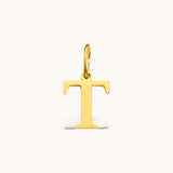 Nadare Co. gold-plated stainless steel initial charm featuring a polished serif letter T for everyday layering.