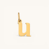 Nadare Co. lower case letter u charm in 14k gold plated stainless steel with a polished finish.