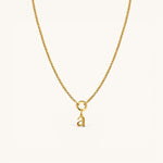 Nadare Co. gold-plated stainless steel lowercase letter a charm pendant on a delicate matching chain