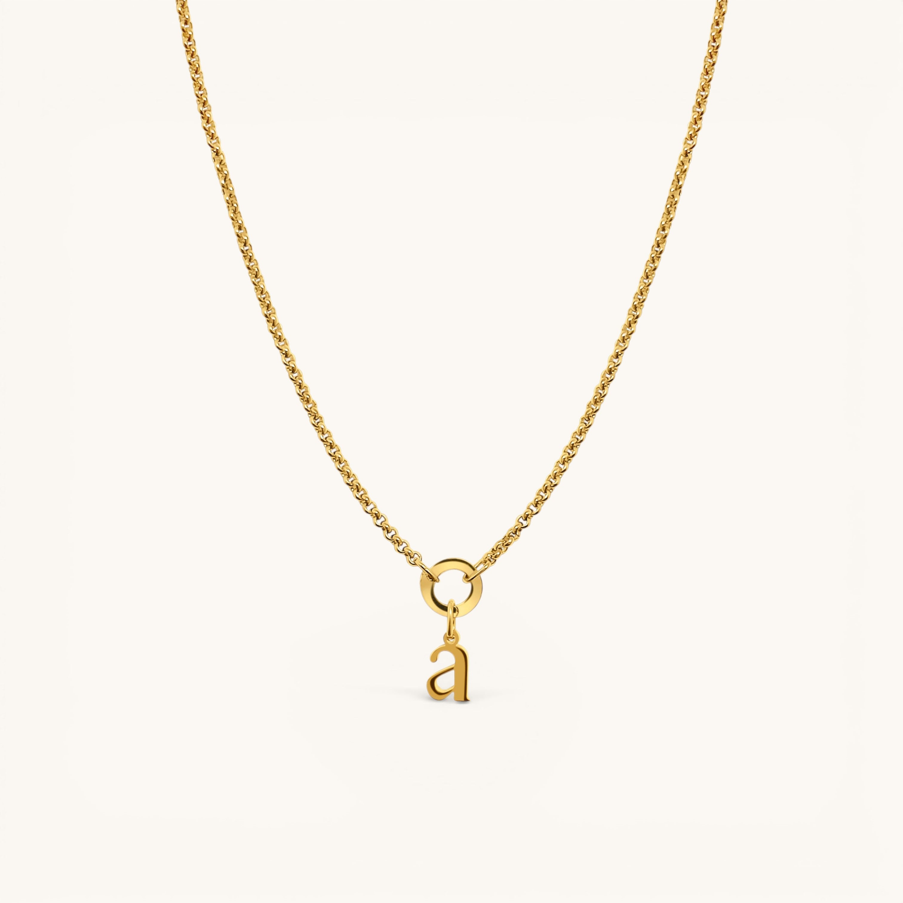 Nadare Co. gold-plated stainless steel lowercase letter a charm pendant on a delicate matching chain
