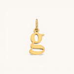Nadare Co. lowercase letter g charm in 14k gold plated stainless steel for everyday layering.