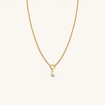 Nadare Co. gold chain necklace featuring a delicate crescent moon charm with a small embedded diamond accent.