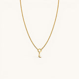 Nadare Co. gold chain necklace featuring a delicate crescent moon charm with a small embedded diamond accent.