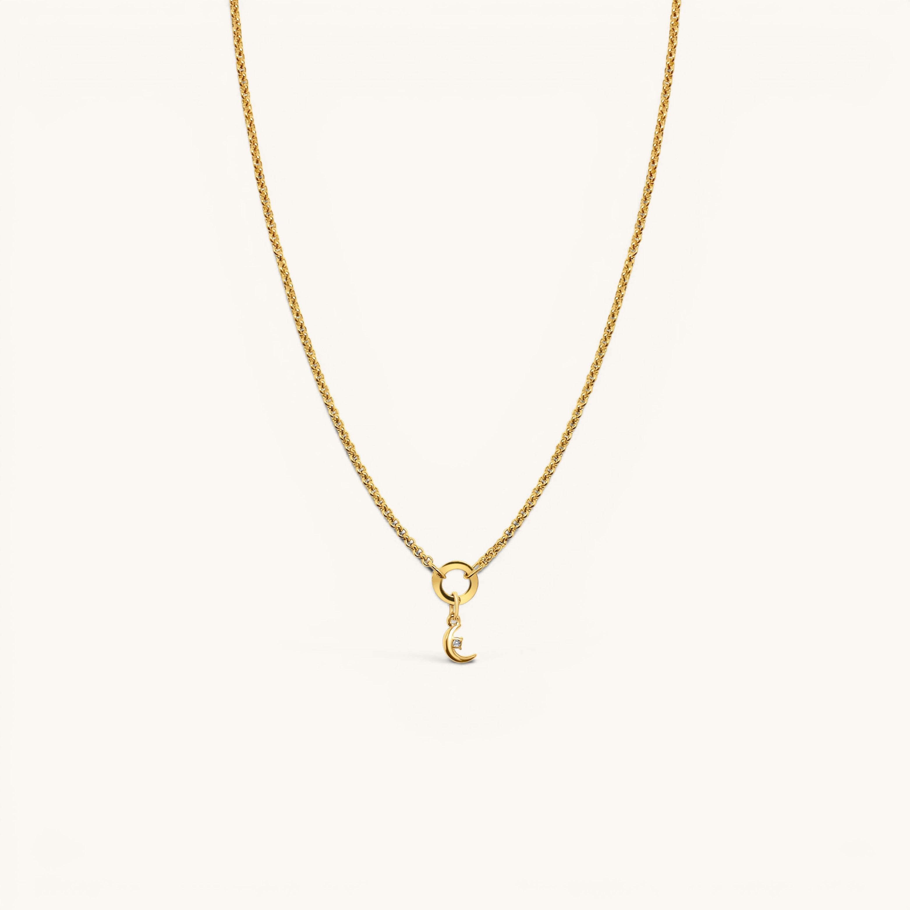 Nadare Co. gold chain necklace featuring a delicate crescent moon charm with a small embedded diamond accent.