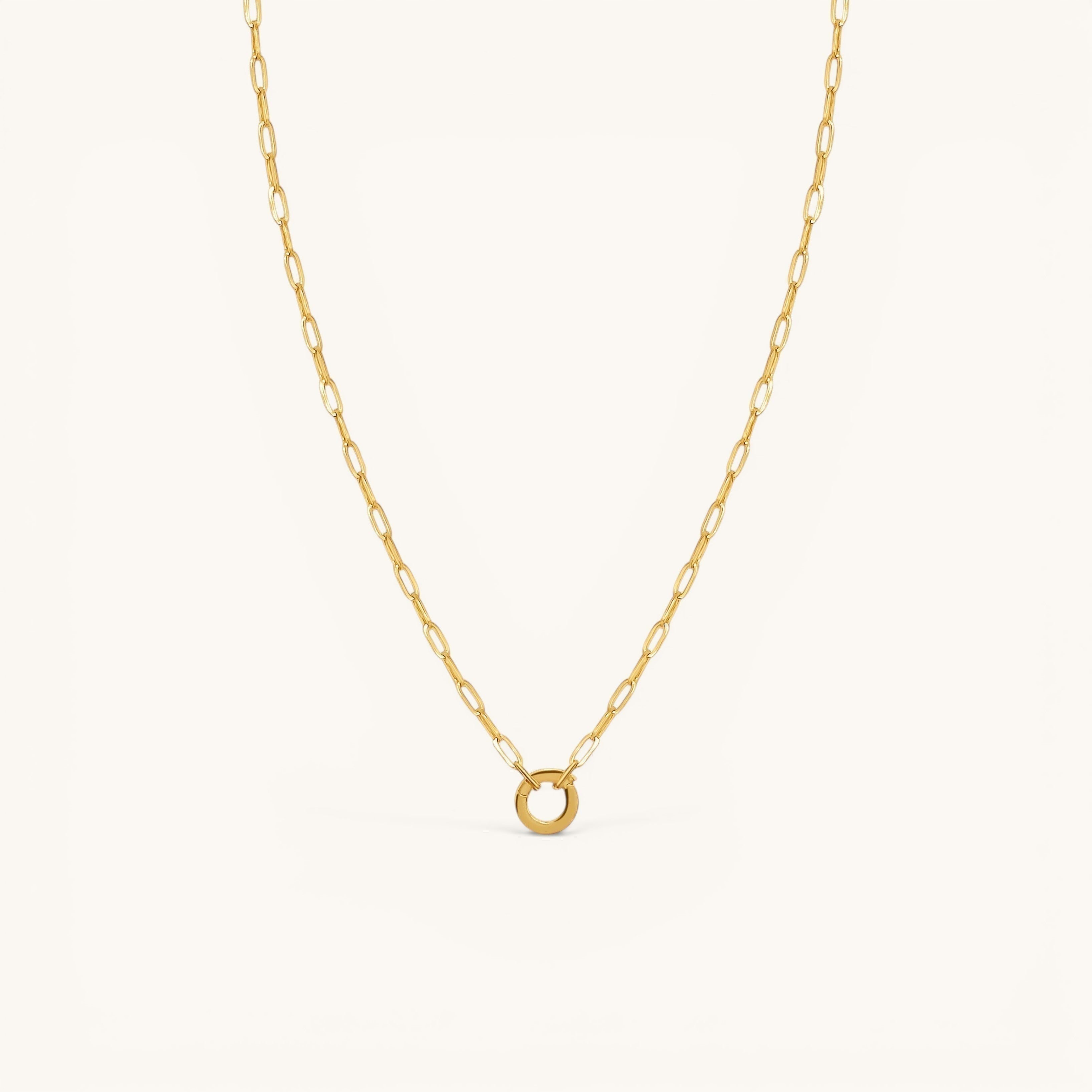 Nadare Co. 14k gold plated stainless steel small oval switch chain necklace with a circular charm attachment point.