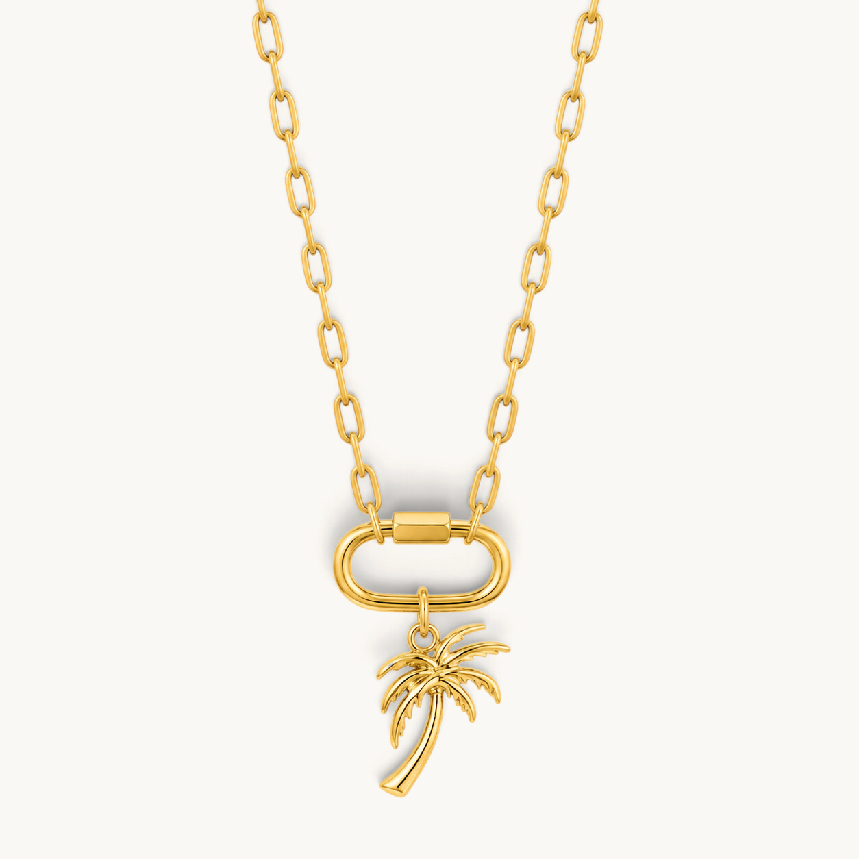 Nadare Co. large gold-plated stainless steel palm tree charm pendant on a matching gold chain with a carabiner clasp.
