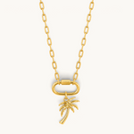 Nadare Co. large gold-plated stainless steel palm tree charm pendant on a matching gold chain with a carabiner clasp.