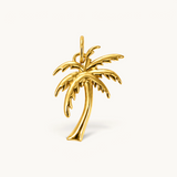 Nadare Co. large palm tree charm in 14k gold-plated stainless steel with sculpted fronds and a slender trunk.
