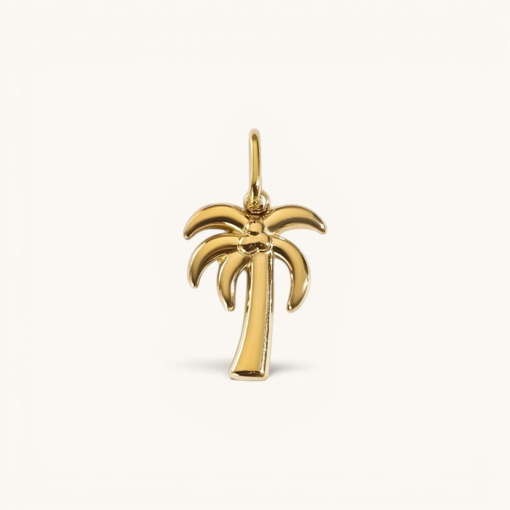 Nadare Co. gold-plated stainless steel palm tree charm for a necklace with a polished coastal design.