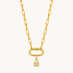 Nadare Co. mini gold padlock charm with cubic zirconia pavé stones on a chunky gold link chain necklace.