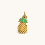 Nadare Co. Pineapple Charm in textured gold with bright green enamel leaves for a tropical necklace accessory.