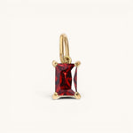 Nadare Co. Dark Academia necklace charm featuring a rectangular ruby-red crystal in a gold setting.