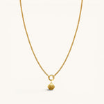 Nadare Co. gold-plated stainless steel scallop shell charm pendant on a delicate gold chain necklace.