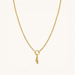 Nadare Co. seahorse charm in 14k gold-plated stainless steel hanging on a delicate gold chain necklace.