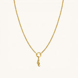 Nadare Co. seahorse charm in 14k gold-plated stainless steel hanging on a delicate gold chain necklace.