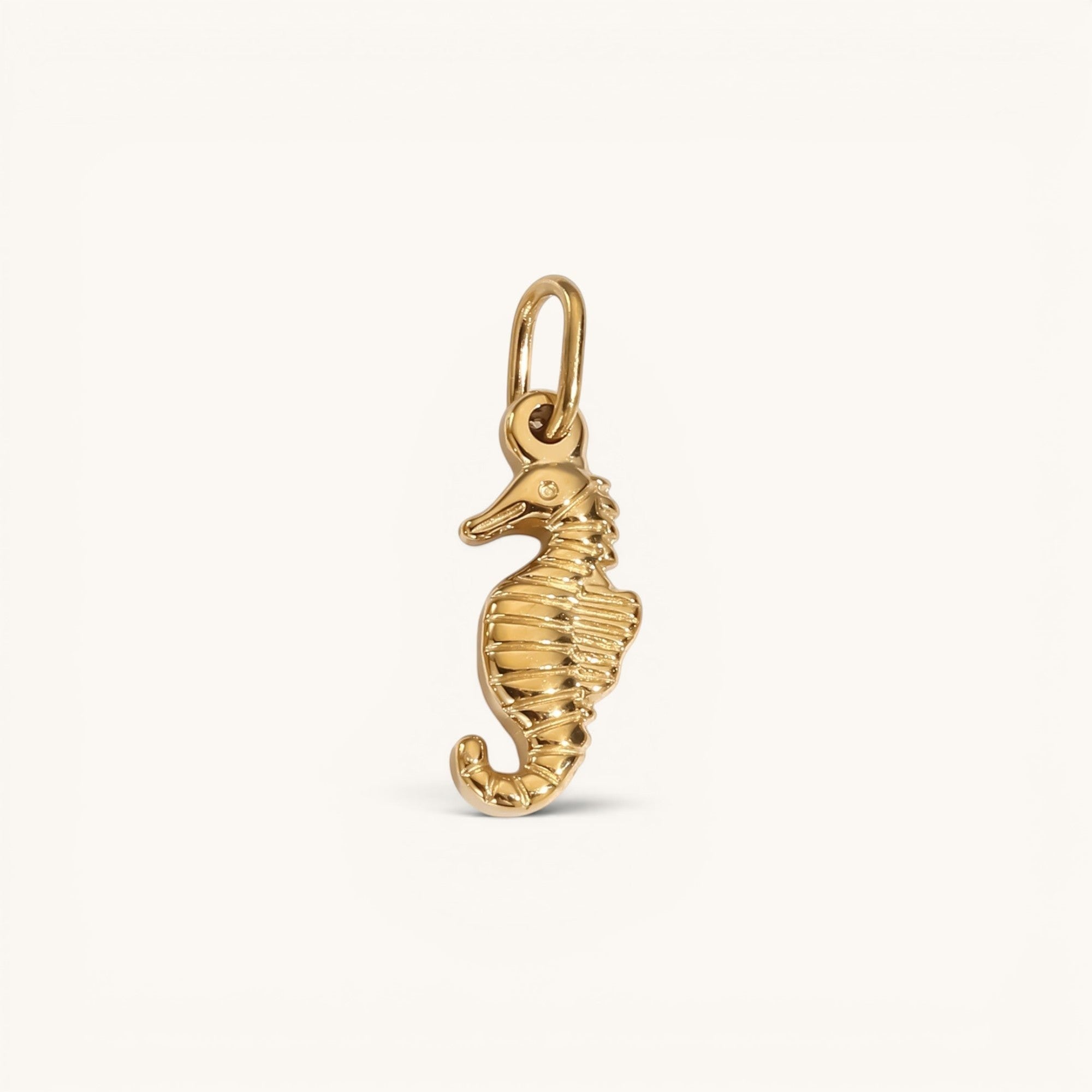 Nadare Co. gold-plated stainless steel seahorse charm with intricate coastal detailing for a charm necklace.
