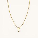 Nadare Co. gold chain necklace featuring a delicate star charm pendant with a small sparkling center stone.