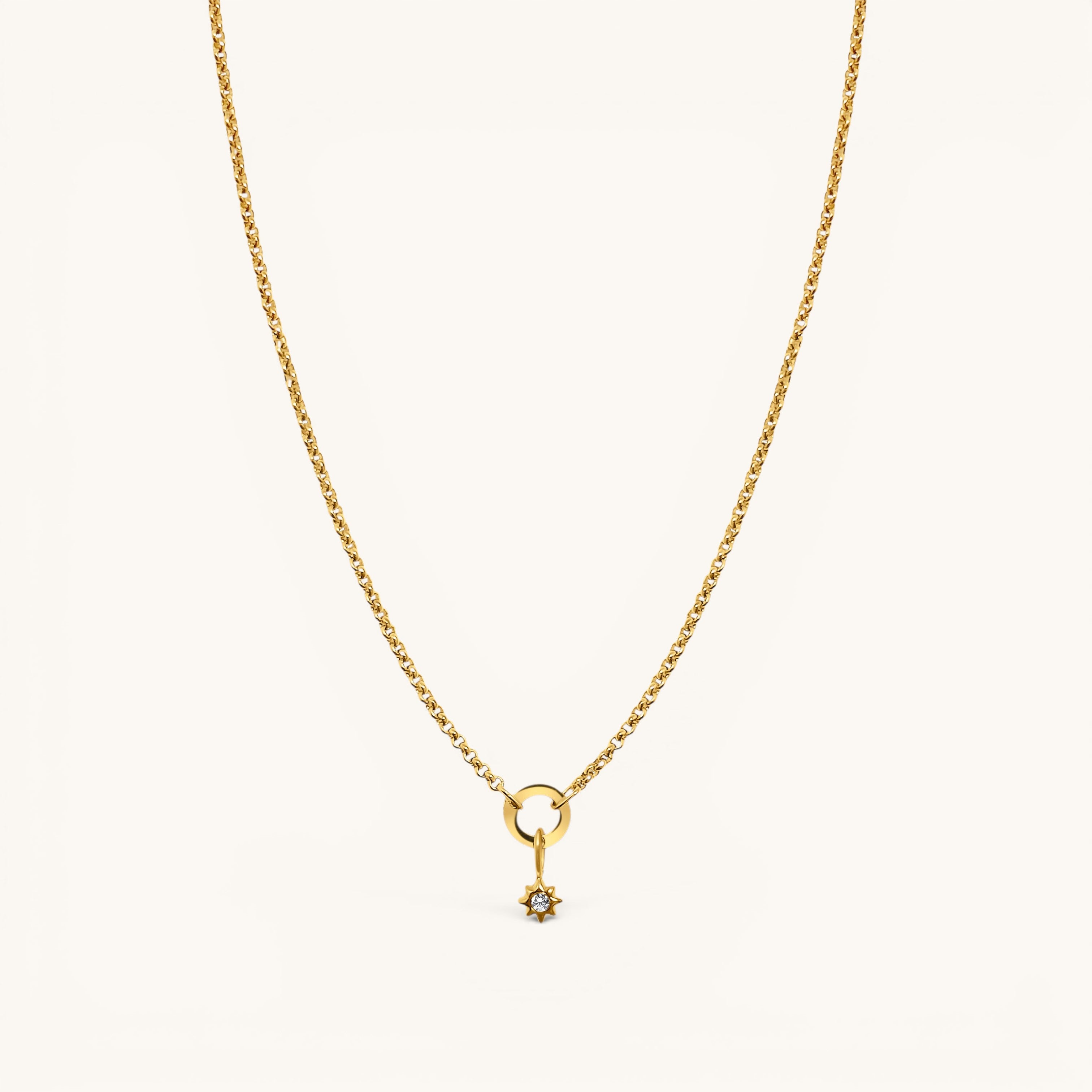 Nadare Co. gold chain necklace featuring a delicate star charm pendant with a small sparkling center stone.