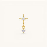 Nadare Co. gold North Star threadless piercing front with a dangling cubic zirconia charm for helix or lobe piercings.