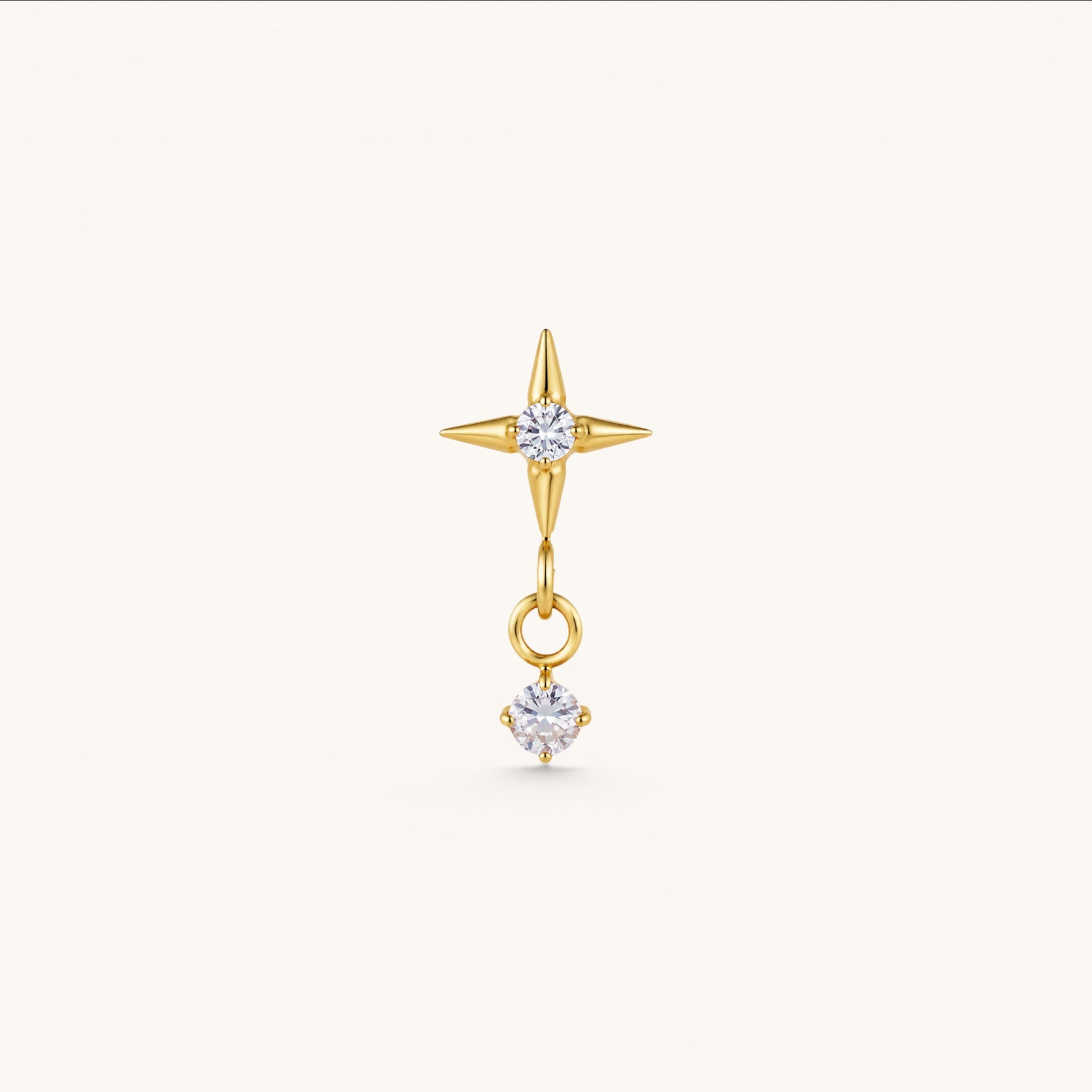 Nadare Co. gold North Star threadless piercing front with a dangling cubic zirconia charm for helix or lobe piercings.