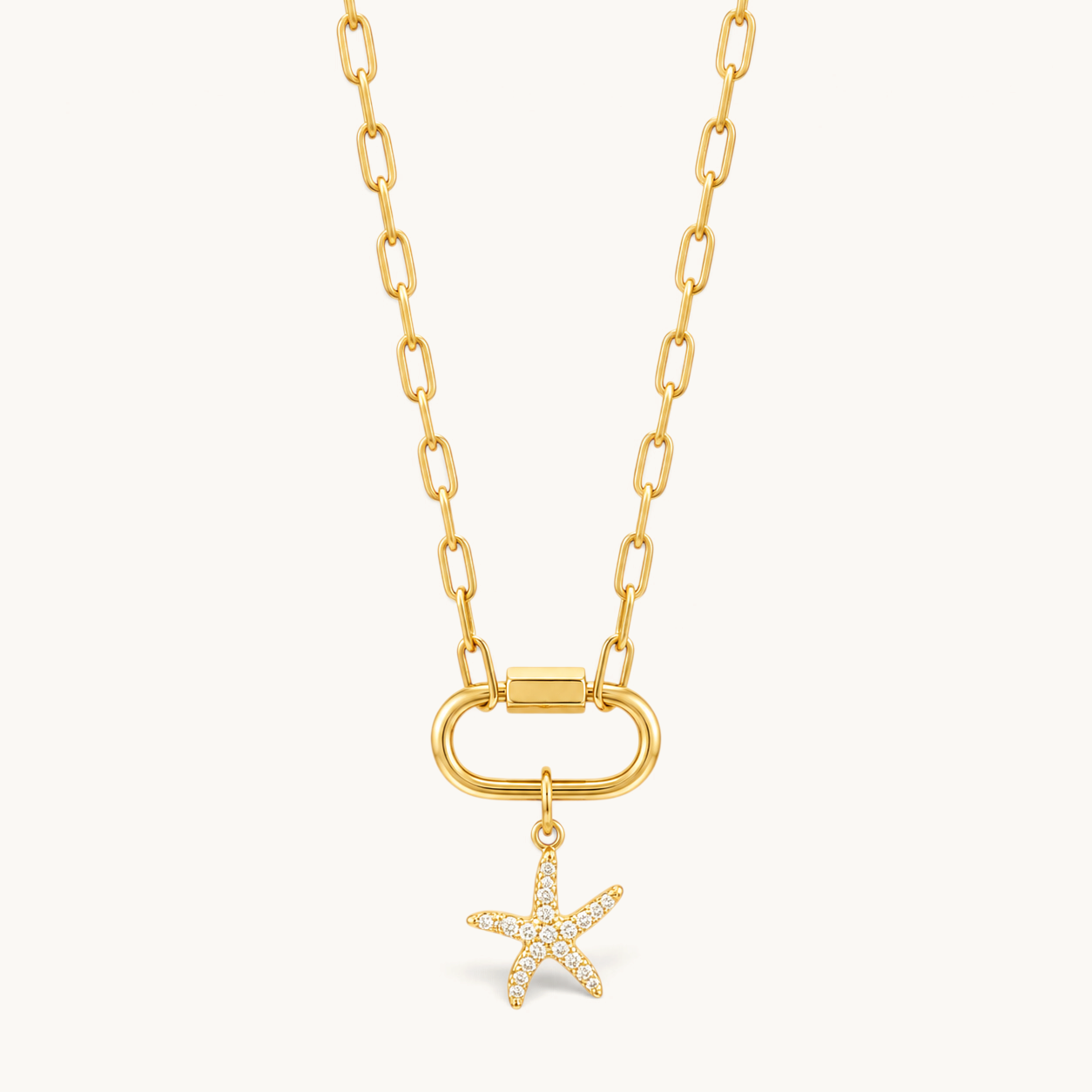 Nadare Co. gold starfish charm with cubic zirconia pavé stones on a gold link chain necklace.
