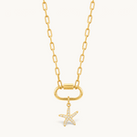 Nadare Co. gold starfish charm with cubic zirconia pavé stones on a gold link chain necklace.