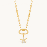Nadare Co. gold starfish charm with cubic zirconia pavé stones on a gold link chain necklace.