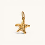 Nadare Co. mini starfish charm in 14k gold-plated stainless steel with a polished, rounded coastal design.