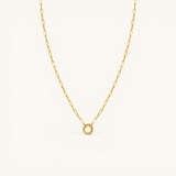 Nadare Co. gold chain necklace featuring a circular switch clasp for holding up to three charms.