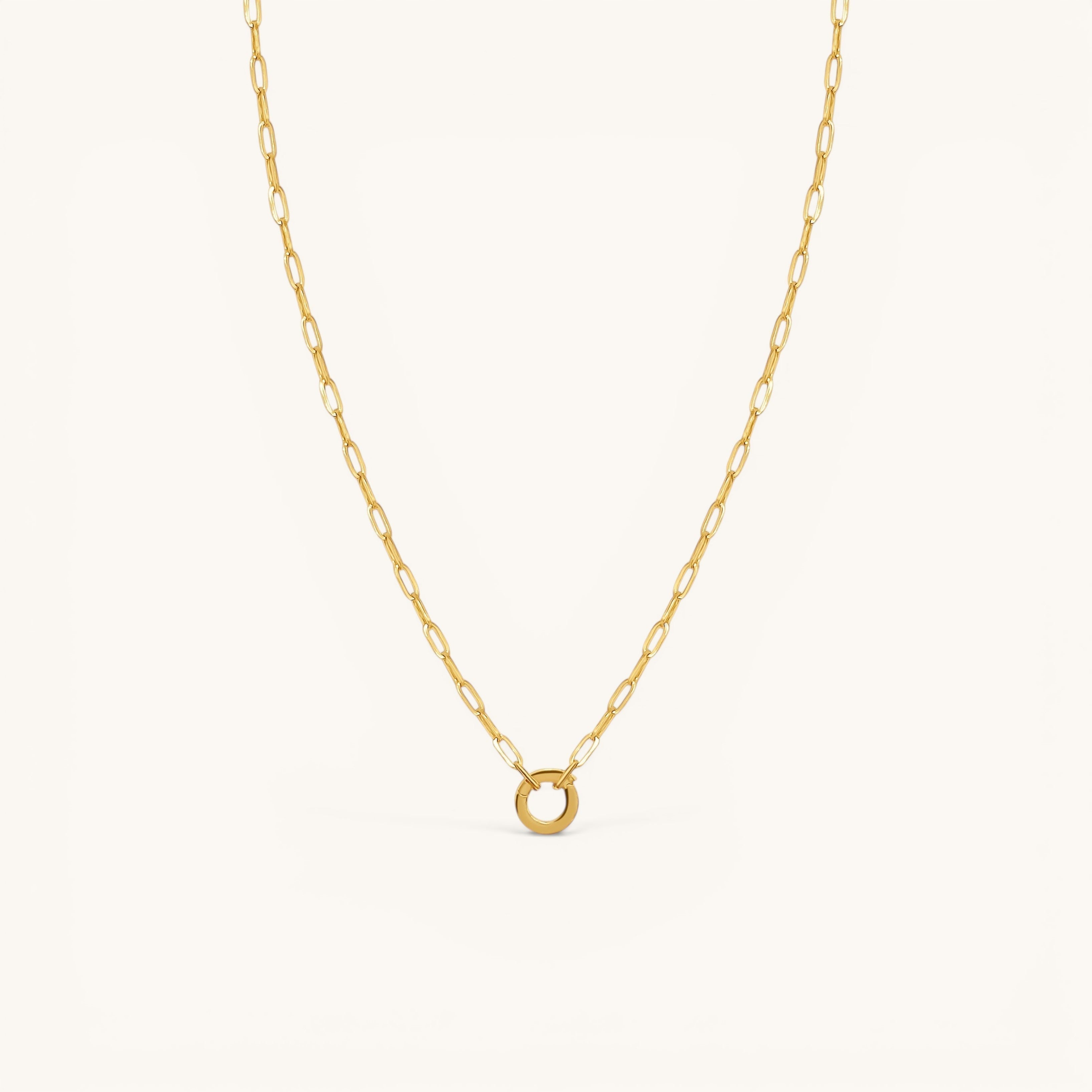 Nadare Co. gold chain necklace featuring a circular switch clasp for holding up to three charms.