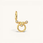 Nadare Co. gold-plated Taurus zodiac charm featuring sparkling cubic zirconia stones on a stainless steel base.