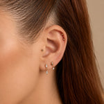 Nadare Co. Iris Threadless Front gold-plated titanium bead piercing jewelry worn in a curated ear stack