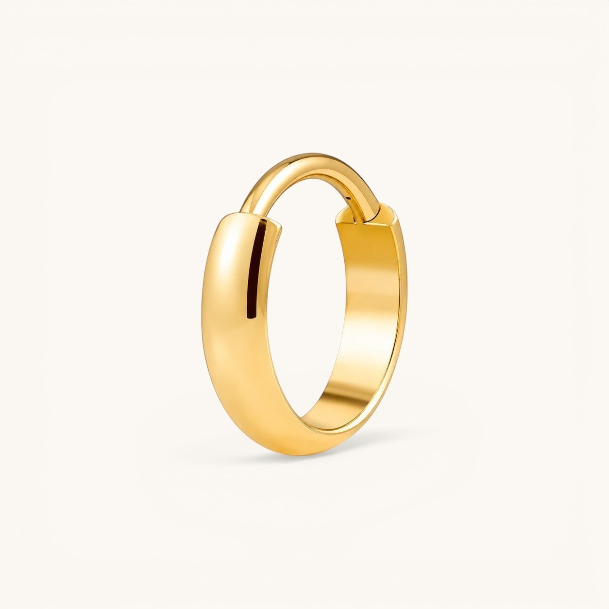 Nadare Co. Cleo Clicker Hoop in polished gold-tone titanium with a secure hinged closure for versatile piercings.