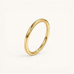 Nadare Co. gold-plated titanium clicker ring with a smooth polished finish and secure hinged closure for piercings.