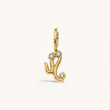Nadare Co. gold plated Zodiac Charm featuring cubic zirconia accents on a stainless steel base
